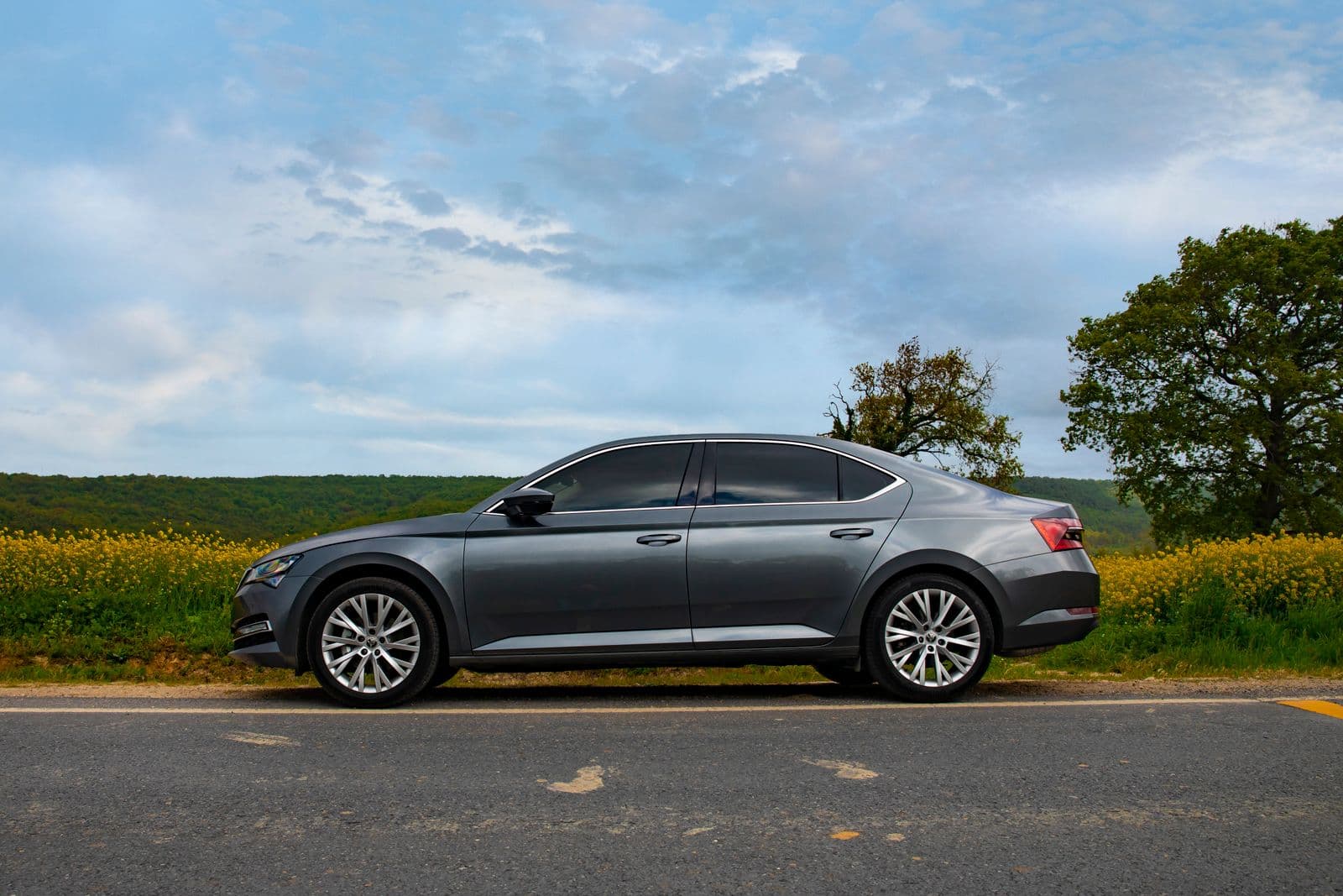 Silver estate car on a country road